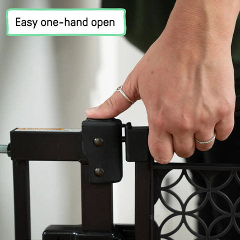 Hand operating No-Drill Expandable Baby And Dog Gate 28 To 42 Inch Wide, 30 Inch Tall, Espresso, showing easy one-hand open feature