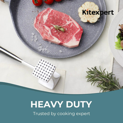 Meat Tenderizer Hammer With Comfortable Grip Handle Dual Sided Mallet next to raw steak on plate with garlic and rosemary