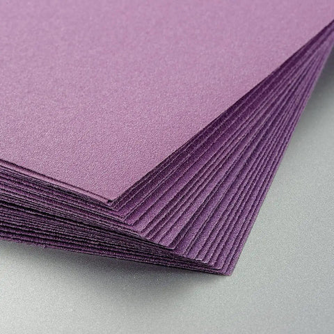 Close-up of 600 Grit Wet Dry Sanding Sheets 9 By 11 Inch Set White Fused Alumina Abrasive Pro Grade for wood and metal finishing.