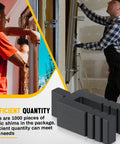 Front view of 1000-piece black plastic shims, 1/16 x 3-1/2 in, stackable for windows/doors, installers in background.