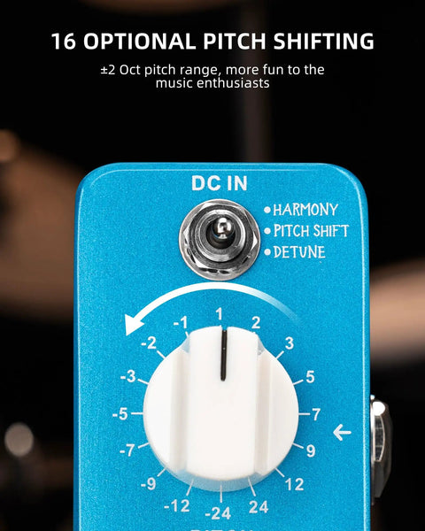 Close-up of mini pitch shifter pedal with Harmony, Detune, and Pitch Shift modes for electric guitar and bass.
