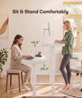 Heavy Duty Glass Electric Standing Desk With Effortless Height Control For Compact Home Office Setup 35 X 20 Inch Wipe Clean Top with two users.