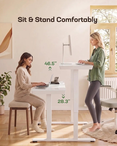 Heavy Duty Glass Electric Standing Desk With Effortless Height Control For Compact Home Office Setup 35 X 20 Inch Wipe Clean Top with two users.