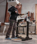Person using 12 By 21 Inch Variable Speed Woodworking Lathe With 1 HP 115V 1 Phase Three RPM Ranges in workshop