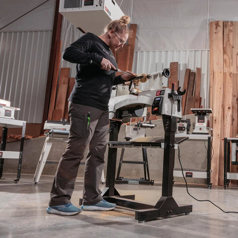 Person using 12 By 21 Inch Variable Speed Woodworking Lathe With 1 HP 115V 1 Phase Three RPM Ranges in workshop