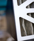 Close-up of Remote Controlled Air Filtration System with three speed settings and RF remote, showing filter details