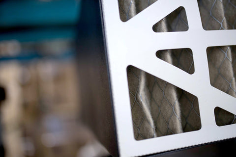 Close-up of Remote Controlled Air Filtration System with three speed settings and RF remote, showing filter details