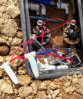 Direct Burial Wire Connector DryConn DIY Friendly Blue Waterproof Sealant used in outdoor electrical box installation.