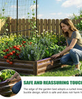 Woman tending to Do It All Galvanized Raised Garden Bed Set With Two Beds And 87 Inch Arch Trellis For Climbing Plants Outdoor Metal Planter Box With Netting And Wood Grain Finish For Flowers Vegetables And Fruit