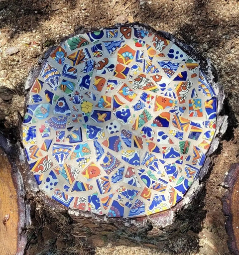 Round mosaic made from 10 Pound Bundle Of Broken Mexican Talavera Tiles For Mosaic Projects And DIY Decor, vibrant colors and patterns.