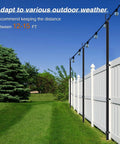 Adjustable 10 Foot Outdoor String Light Poles for Yard and Patio with Quick Assembly next to a white fence and green lawn