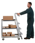 Top Shelf Aluminum Stock Picker Cart With Built In Steel Step Ladder 1000 Lb Max Payload Rating Double Shelf Rolling Platform used for moving boxes.