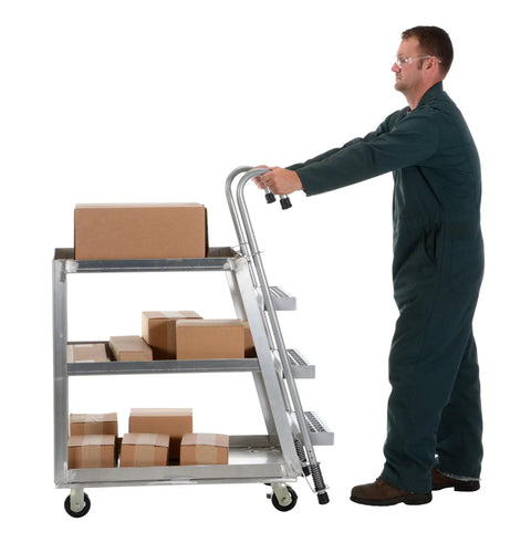 Top Shelf Aluminum Stock Picker Cart With Built In Steel Step Ladder 1000 Lb Max Payload Rating Double Shelf Rolling Platform used for moving boxes.