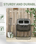 Dual Chamber 43 Gallon Rotating Compost Tumbler With 360 Degree Tumbling, shown in garden setting against wood fence.