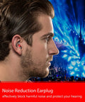 Person wearing noise reduction earplug with blue lights in the background at a concert.