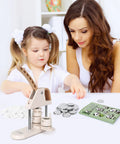 Mother and child using 3 In 1 Button Maker Kit With 300 Supplies Including Pin Badge Press In 25mm 32mm And 58mm Sizes, Ergonomic Arc Handle, Circle Cutter, And DIY Craft Book For Kids, Fam Fun, And Creative Projects at a table