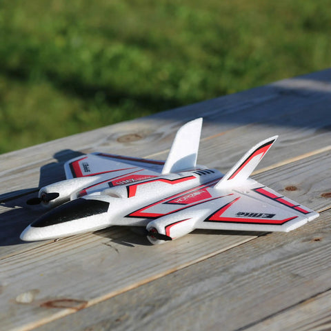 Ultra Micro RC Plane With Dope Twin Brushless Motors And Delta Wing BNF Basic Electric in white and red on wooden table