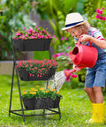 Child watering a space saving 3 tier raised garden bed vertical planter with drainage holes on patio with colorful flowers