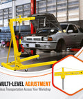 Heavy Duty Folding Engine Hoist With Adjustable Telescopic Boom Two Ton Cherry Picker positioned next to a car for easy engine lifting in garage.