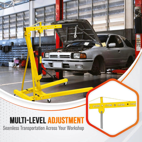 Heavy Duty Folding Engine Hoist With Adjustable Telescopic Boom Two Ton Cherry Picker positioned next to a car for easy engine lifting in garage.