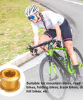Cyclist riding road bike with image of Five Pack M8 Aluminum Chainring Bolts For Road And MTB Bikes in yellow focused on foreground.