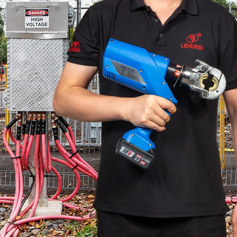Badass 6 Ton Electric Hydraulic Crimping Pliers With 12 Universal Dies For Cable Lugs And Wire Terminations Delivers Knockout Force With Copper Motor And No Sweat Cooling Operation in use with high voltage cables.