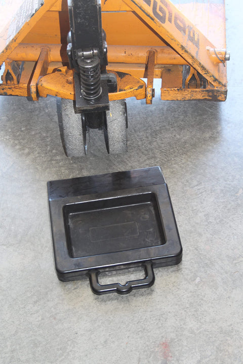 Pallet Jack Wheel Chock Stop Rolling In Trailers Or Trucks Rubber Heavy Duty With Base Black on concrete floor