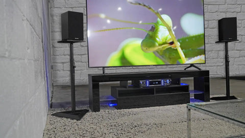 Heavy Duty Studio Monitor Speaker Stands with 60 lb Capacity, beveled base, and sturdy steel construction in a home audio setup.