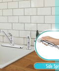 Premium Single Handle High Arc Kitchen Faucet With Swivel Side Spray, Polished Chrome Finish shown with side sprayer in use.