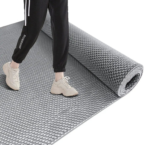 Person stepping on a Heavy Duty PVC Drainage Mat 3 Ft By 10 Ft, One Quarter Inch Thick, No Slip Anti Fatigue Floor Mat For Wet Areas