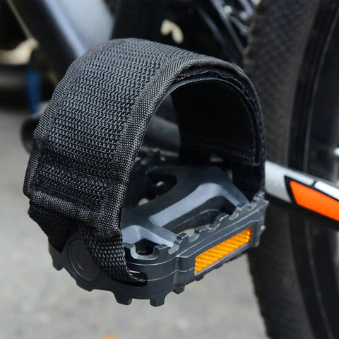 Two Pairs Kids Bicycle Foot Strap Pedal Straps For Fixed Gear Bikes Adjustable Nylon Foot Straps Durable Non Slip Pedal Straps Fits Most Shoes Great For Safe Secure Rides shown attached to a bike pedal.