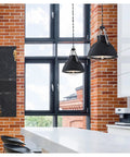 Bartley Vintage-Style One-Light Indoor Pendant Light With Matte Black Finish, Dark Pewter Accents in modern kitchen setting.