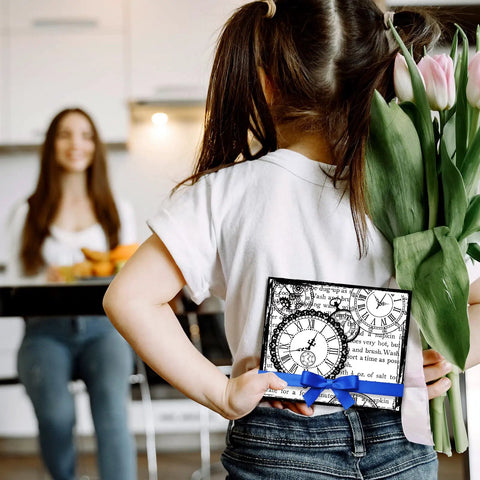 Girl holding a gift with Total Standout Vintage Clock Silicone Clear Stamps With Gear Shapes, behind tulips, smiling mother in background.