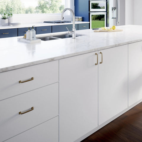 White kitchen cabinets with Champagne Bronze Cabinet Pulls 4 Inch Center To Center 5 Pack Drawer Handles, zinc finish installed.