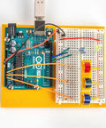 Arduino board setup with breadboard from Six Pack Arduino Starter Kits For Classroom Use With English Projects Book