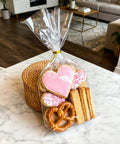 Heckin Great Cellophane Treat Bags 7 X 14 Inches With Gold Twist Ties 100 Pack Sturdy Opp Material Perfect For Cookies Candy Snacks Chocolate Marshmallow Wrapping filled with decorated cookies and pretzels.
