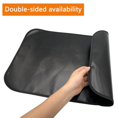 Person holding a Heat Resistant Fire Pit Mat For Deck And Tabletop 25 By 17 Inch Waterproof Oilproof Heavy Duty 4 Layer Pad