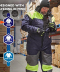 Heavy Duty Insulated Freezer Work Coveralls Built To Blast Through The Deep Freeze With Rock Solid Thermal Armor and Water Repellent Winter Job Gear For Cold Storage Crews on man in warehouse.