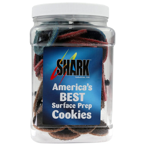 Clear storage jar with nonwoven discs labeled 'America's Best Surface Prep Cookies' by Shark Industries.