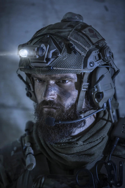 Sidewinder 55 Lumen Compact II Military Flashlight mounted on a helmet for hands free lighting with 185 degree tilt