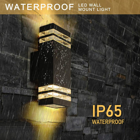 12.8 Inch LED Outdoor Rectangle Wall Sconce Light Two Pack Dope Black Exterior Flood Light With IP65 Waterproof 2700K Warm White, mounted on wall in rain