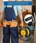Worker holding Heavy Duty Extension Cord Reel With Four Grounded Outlets Open Retractable Cord Winder visible in workshop