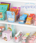 Six Pack Clear Plastic Organizer Bins With Handles For Home Organization Kitchen Pantry Fridge Freezer Cabinets And Garage Storage 10x8x5 Inches Great For Fridges Freezers Cabinets And More filled with snacks and drinks on white shelves