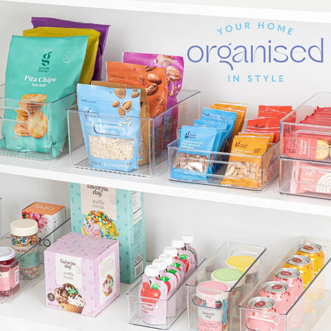 Six Pack Clear Plastic Organizer Bins With Handles For Home Organization Kitchen Pantry Fridge Freezer Cabinets And Garage Storage 10x8x5 Inches Great For Fridges Freezers Cabinets And More filled with snacks and drinks on white shelves