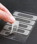 Close-up of 50 Piece Window Screen Repair Kit with self-adhesive mesh patches for easy, tool-free repair of door and window screens.