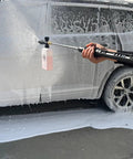 Person using Adjustable Length High Power Washer Gun 5000 PSI With Foam Cannon And Quick-Change Nozzles for car washing