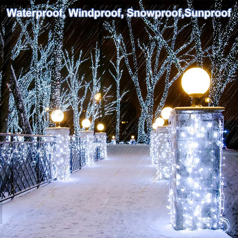 Ultra Long 403 Ft 1000 LED Outdoor Christmas Lights 8 Modes Waterproof Plug In with Timer illuminating a snowy path