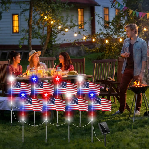 Outdoor gathering with Lit Patriotic Solar Flag Lights For Outdoors, 8 Pack Pathway Stakes illuminating a yard scene