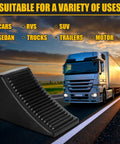Heavy Duty Rubber Wheel Chocks Four Pack with ribbed design beside a truck at sunset