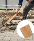 Two Pack Beech Wood 35 Inch Pick Axe Handle Replacement in use with clear varnish coating for heavy duty pickaxe and mattock tools.